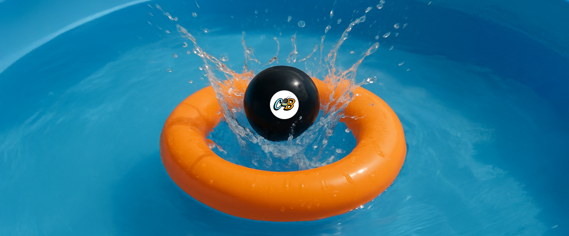 Cannonball splashing into a blue pool in the middle of an orange scoring ring. 